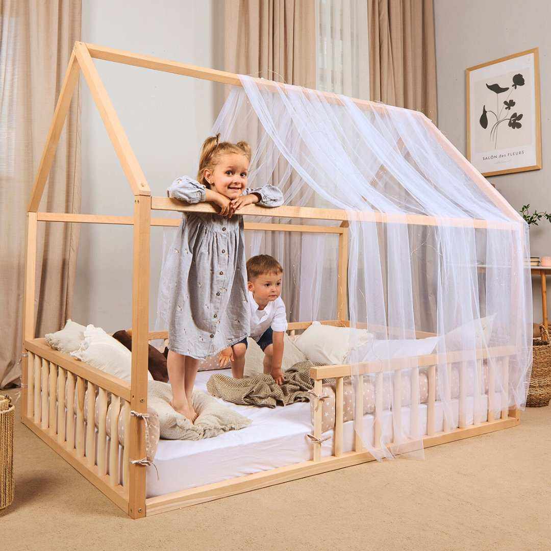 Hausbett Montessori wooden kid's floor bed with house frame and sheer canopy for toddlers and children