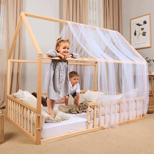 Hausbett Montessori wooden kid's floor bed with house frame and sheer canopy for toddlers and children